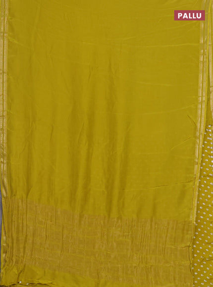 Semi mysore silk saree lime yellow with plain body and temple design zari woven border