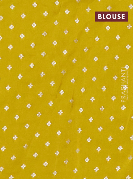 Semi mysore silk saree lime yellow with plain body and temple design zari woven border