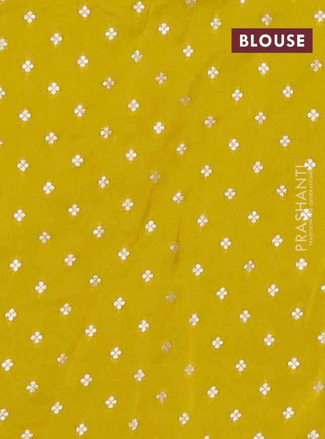 Semi mysore silk saree lime yellow with plain body and temple design zari woven border