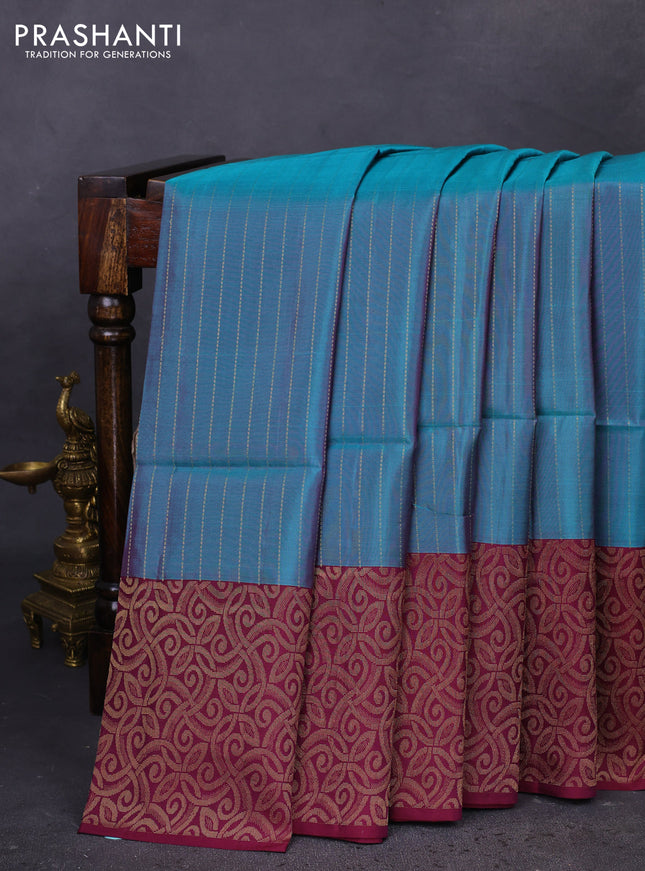 Kanchipuram soft silk saree dual shade of peacock green and wine shade with allover zari woven stripes pattern and rich zari woven border