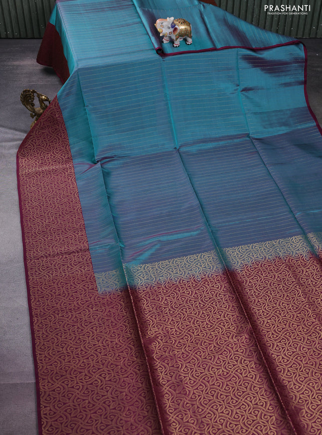 Kanchipuram soft silk saree dual shade of peacock green and wine shade with allover zari woven stripes pattern and rich zari woven border