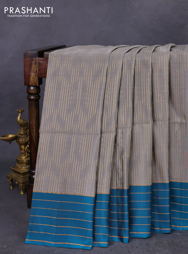Kanchipuram soft silk saree grey and teal blue with allover zari weaves in borderless style