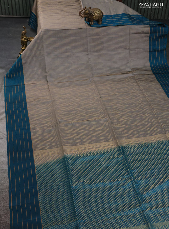 Kanchipuram soft silk saree grey and teal blue with allover zari weaves in borderless style