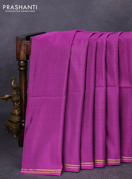 Kanchipuram soft silk saree purple and navy blue with plain body and zari woven simple border