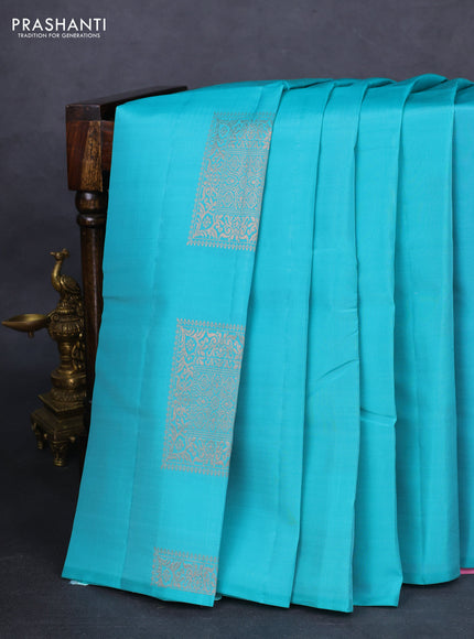 Kanchipuram silk saree teal blue and light pink with zari woven buttas in borderless style