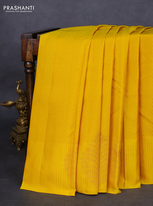 Kanchipuram silk saree yellow and teal blue with allover self emboss and self emboss zari butta border