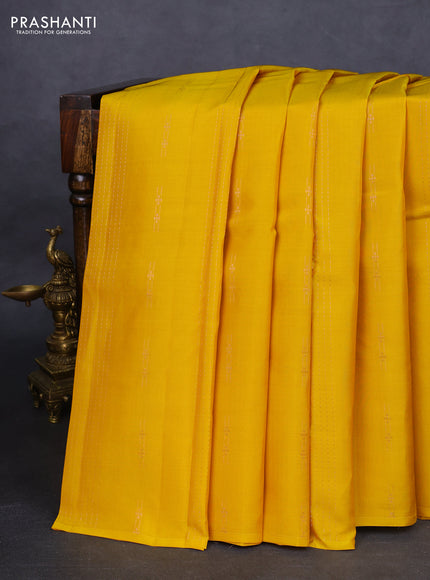 Kanchipuram silk saree yellow and teal green with allover zari weaves in borderless style