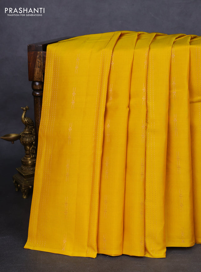 Kanchipuram silk saree yellow and teal green with allover zari weaves in borderless style