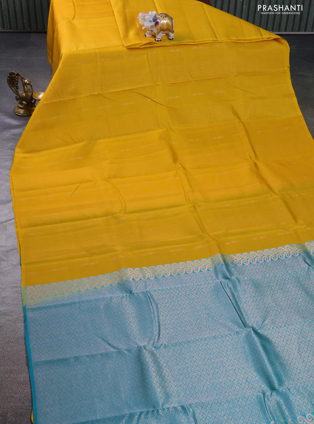 Kanchipuram silk saree yellow and teal green with allover zari weaves in borderless style