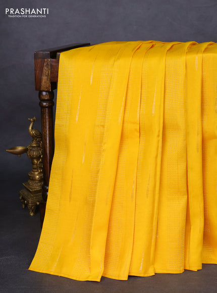Kanchipuram silk saree mango yellow and purple with allover zari weaves in borderless style