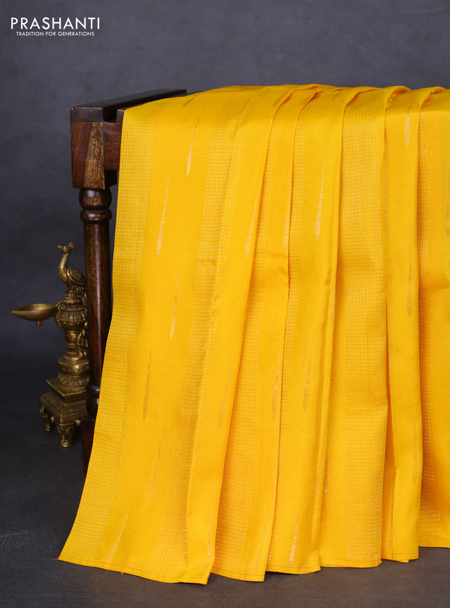 Kanchipuram silk saree mango yellow and purple with allover zari weaves in borderless style