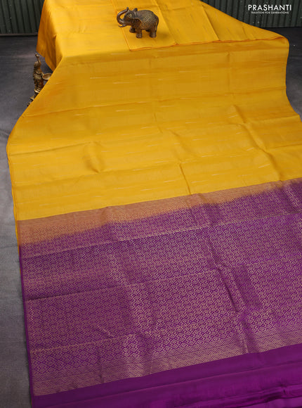 Kanchipuram silk saree mango yellow and purple with allover zari weaves in borderless style