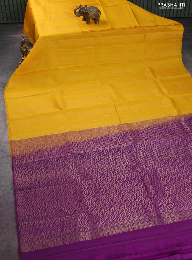 Kanchipuram silk saree mango yellow and purple with allover zari weaves in borderless style
