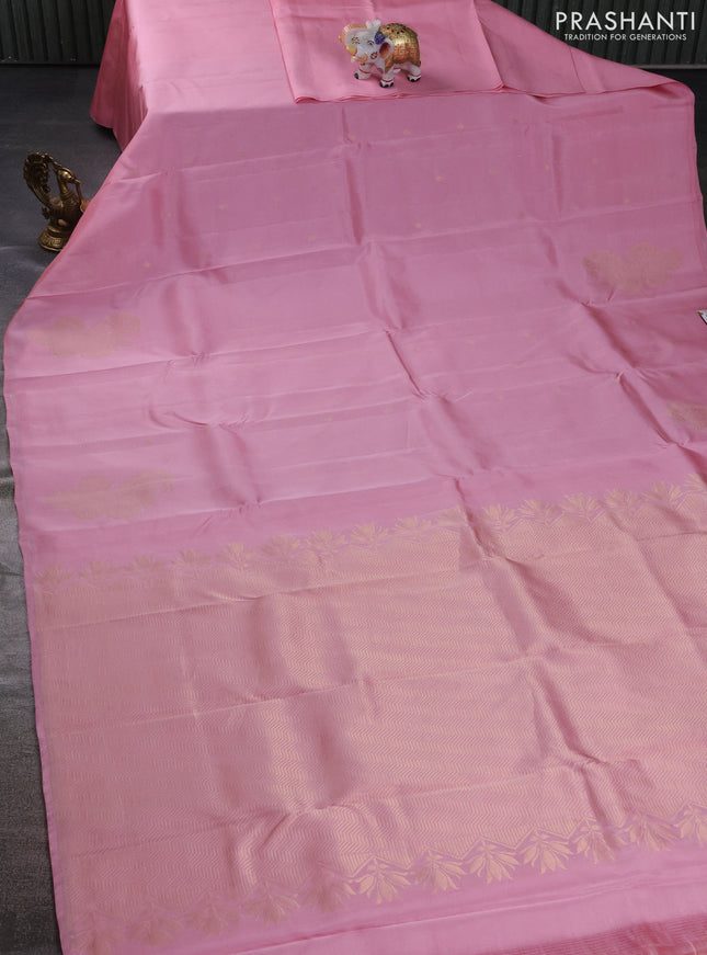 Kanchipuram silk saree pastel pink with zari woven buttas in borderless style