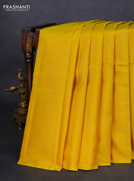 Kanchipuram silk saree yellow and teal green with allover zari weaves in borderless style