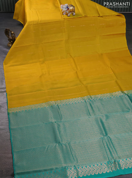 Kanchipuram silk saree yellow and teal green with allover zari weaves in borderless style