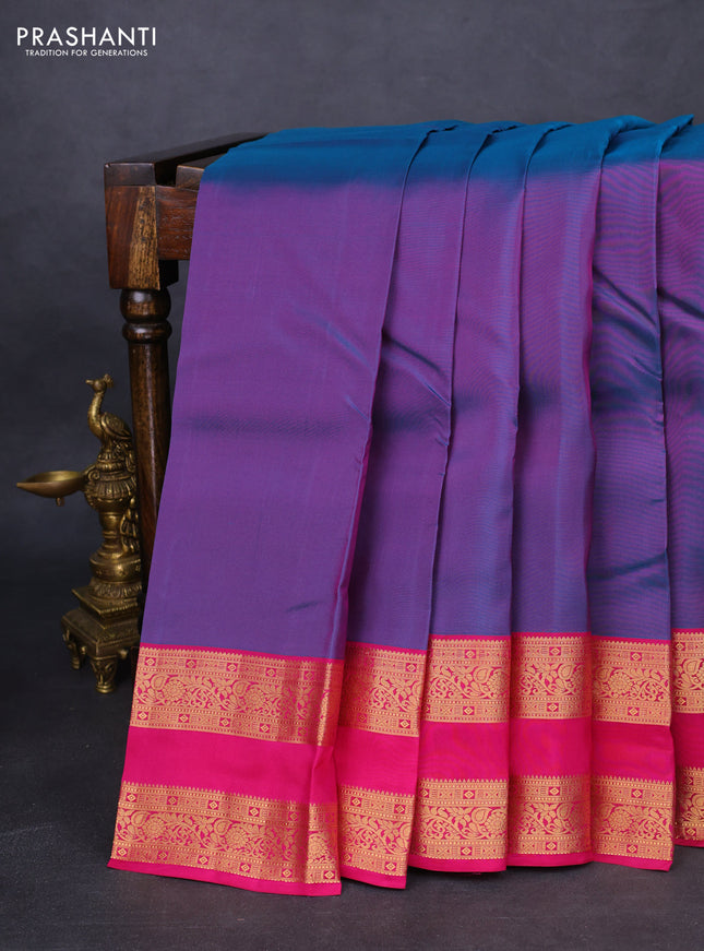Kanchipuram silk saree dual shade of teal green and magenta pink with plain body and rettapet zari woven border