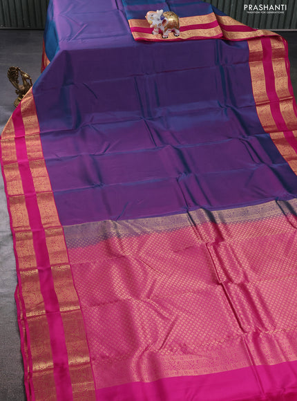 Kanchipuram silk saree dual shade of teal green and magenta pink with plain body and rettapet zari woven border