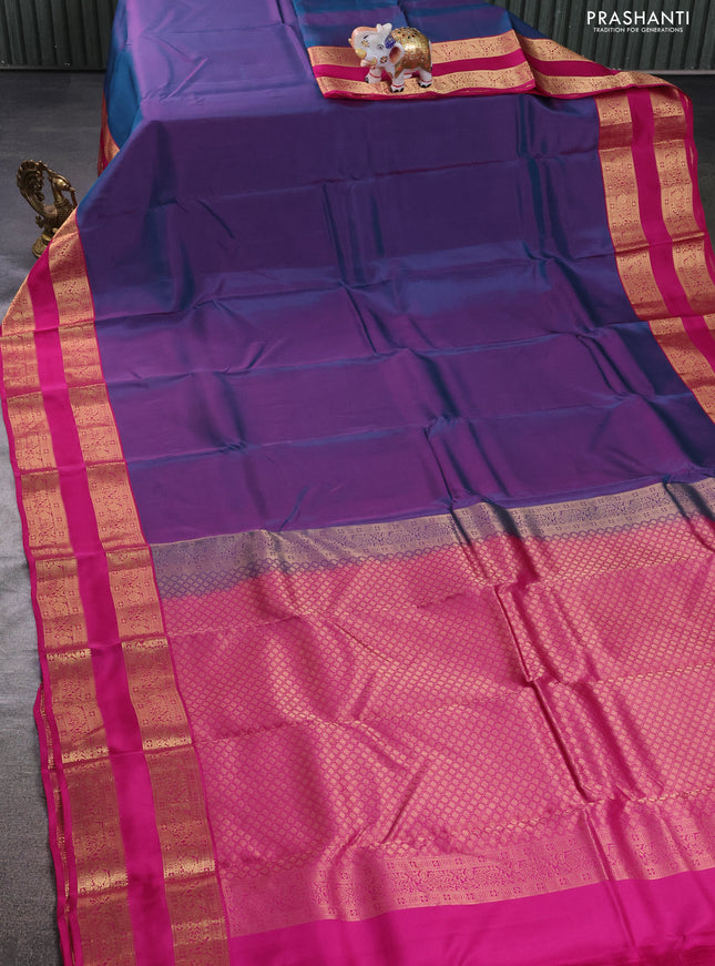 Kanchipuram silk saree dual shade of teal green and magenta pink with plain body and rettapet zari woven border
