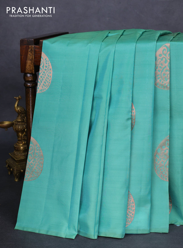 Kanchipuram silk saree teal green shade and cs blue with copper zari woven buttas in borderless style