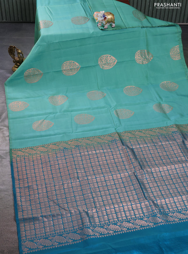 Kanchipuram silk saree teal green shade and cs blue with copper zari woven buttas in borderless style