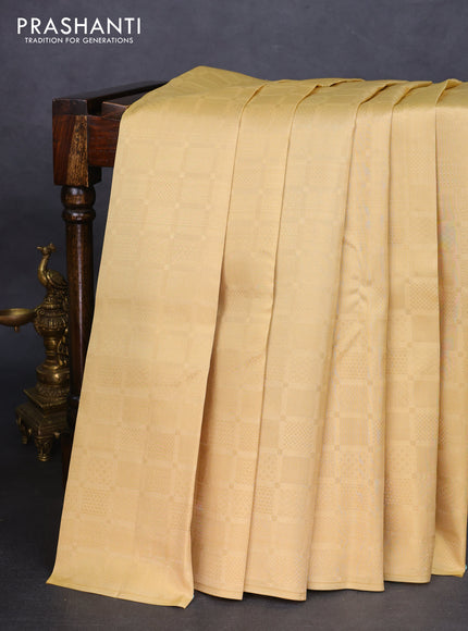 Kanchipuram silk saree ccream and bottle green with allover zari woven brocade weaves in borderless style