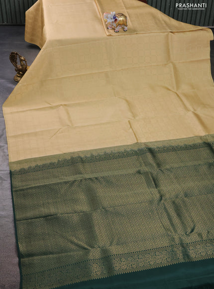 Kanchipuram silk saree ccream and bottle green with allover zari woven brocade weaves in borderless style