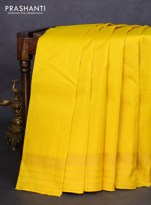 Kanchipuram silk saree yellow and pink with allover zari weaves and zari woven border