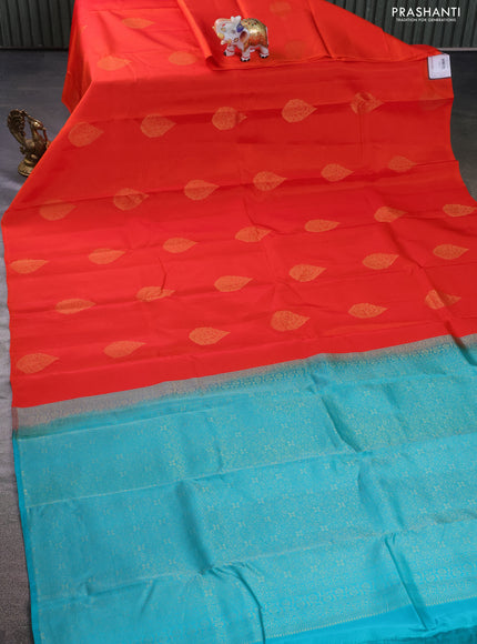 Kanchipuram silk saree orange and teal blue with zari woven buttas in borderless style