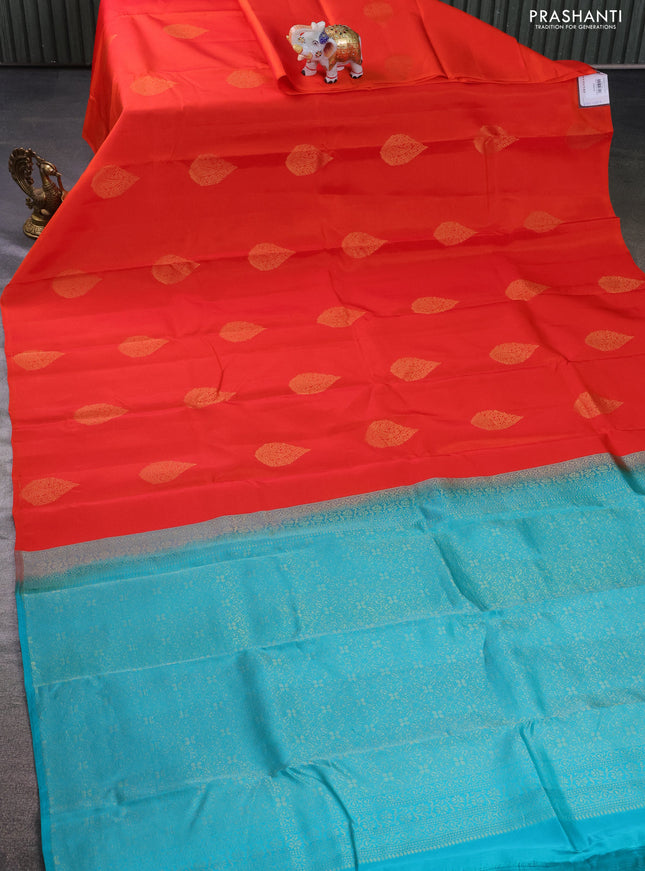 Kanchipuram silk saree orange and teal blue with zari woven buttas in borderless style