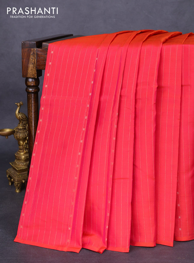 Kanchipuram silk saree dual shade of pinkish orange and teal blue with allover zari weaves in borderless style