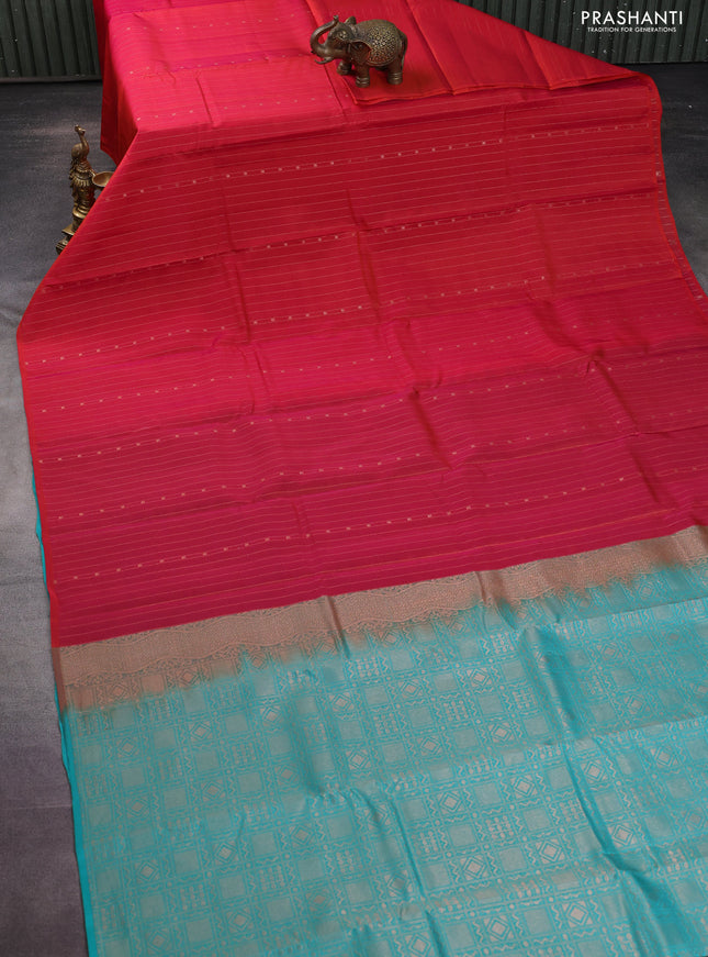 Kanchipuram silk saree dual shade of pinkish orange and teal blue with allover zari weaves in borderless style
