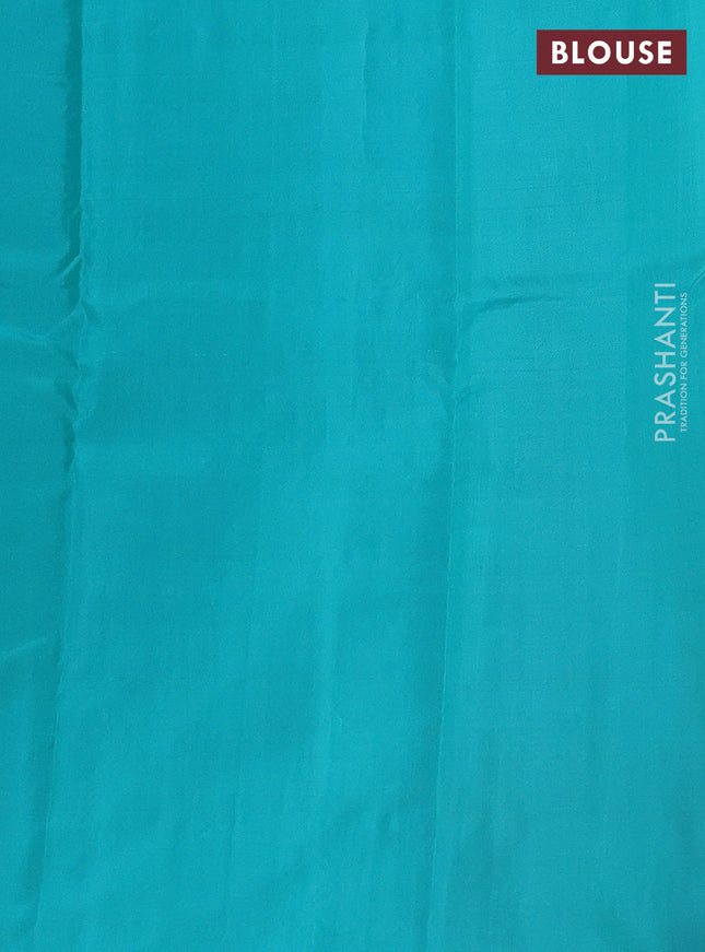 Kanchipuram silk saree dual shade of pinkish orange and teal blue with allover zari weaves in borderless style