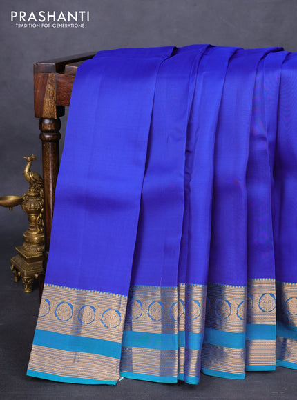 Kanchipuram silk saree blue and dual shade of teal green with plain body and rettapet zari woven border