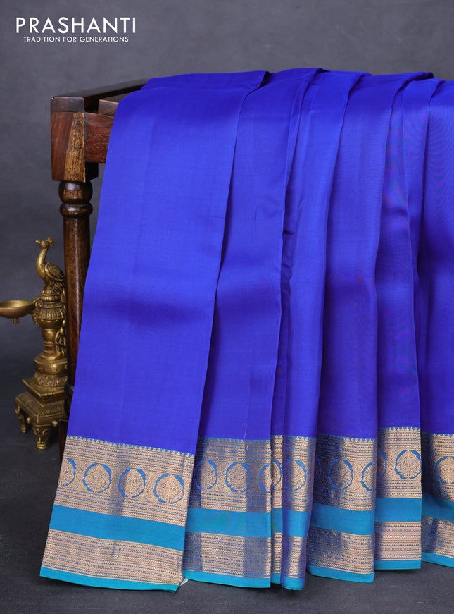 Kanchipuram silk saree blue and dual shade of teal green with plain body and rettapet zari woven border