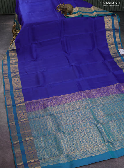 Kanchipuram silk saree blue and dual shade of teal green with plain body and rettapet zari woven border