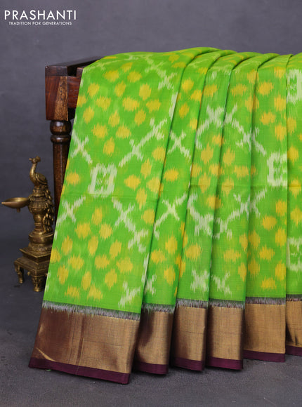 Ikat silk cotton saree light green and deep jamun with allover ikat weaves and zari woven border