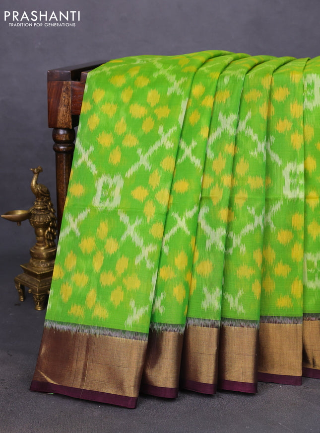 Ikat silk cotton saree light green and deep jamun with allover ikat weaves and zari woven border