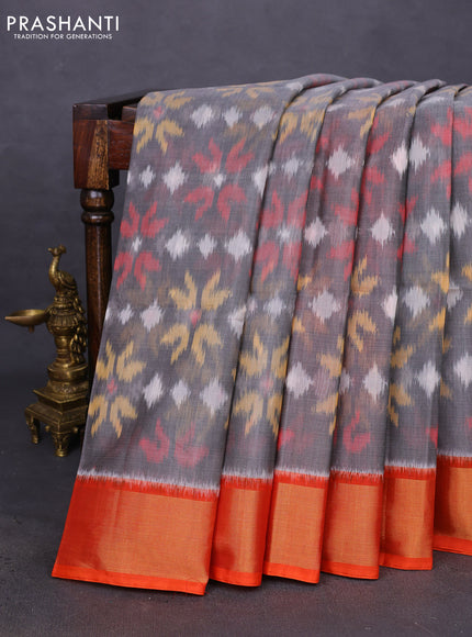 Ikat silk cotton saree grey and orange with allover ikat weaves and zari woven border