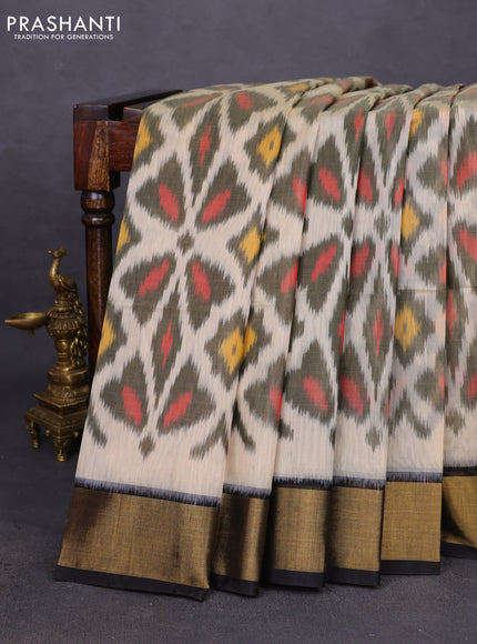 Ikat silk cotton saree cream and black with allover ikat weaves and zari woven border