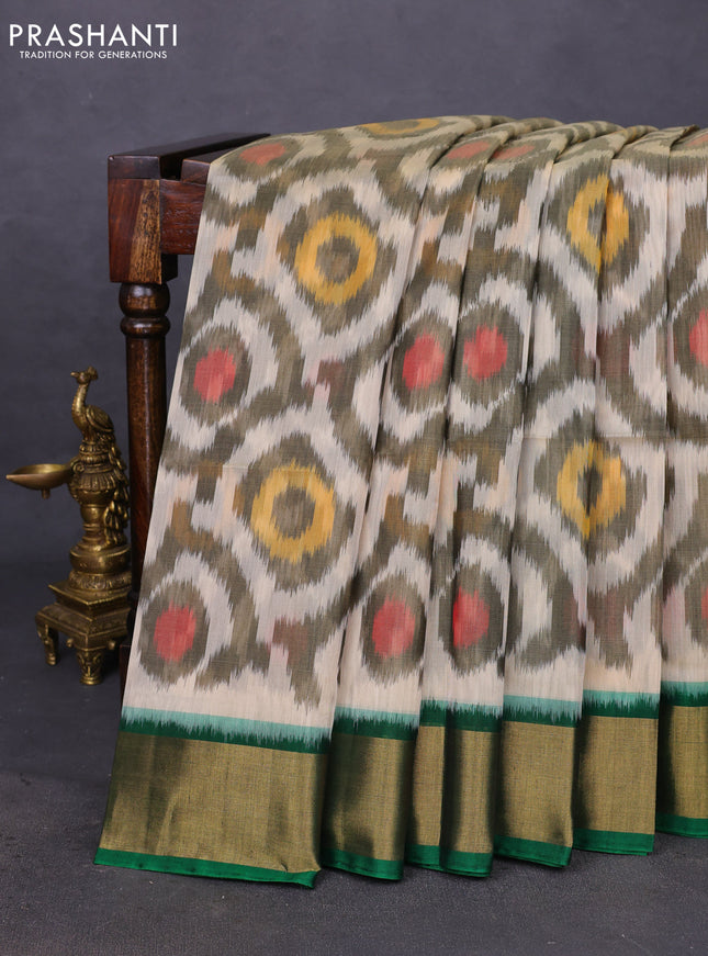Ikat silk cotton saree cream and green with allover ikat weaves and zari woven border