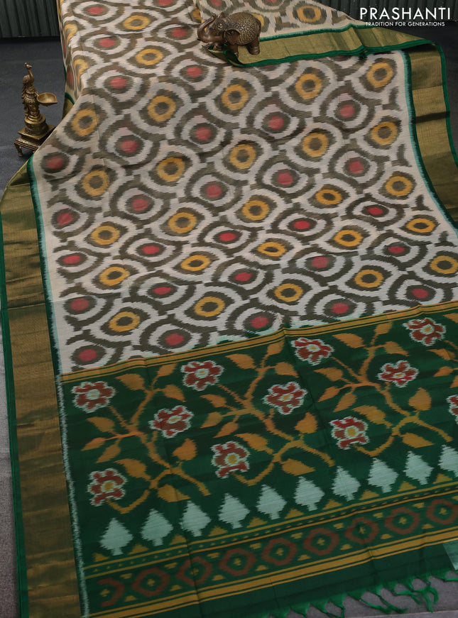 Ikat silk cotton saree cream and green with allover ikat weaves and zari woven border