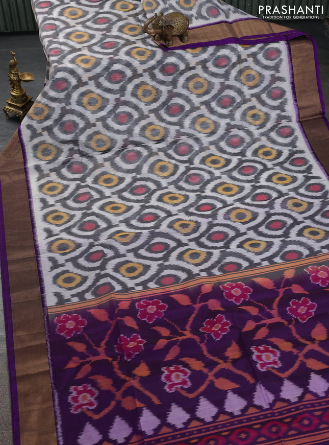Ikat silk cotton saree off white and violet with allover ikat weaves and zari woven border