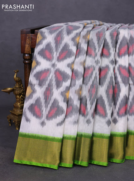 Ikat silk cotton saree off white and light green with allover ikat weaves and zari woven border