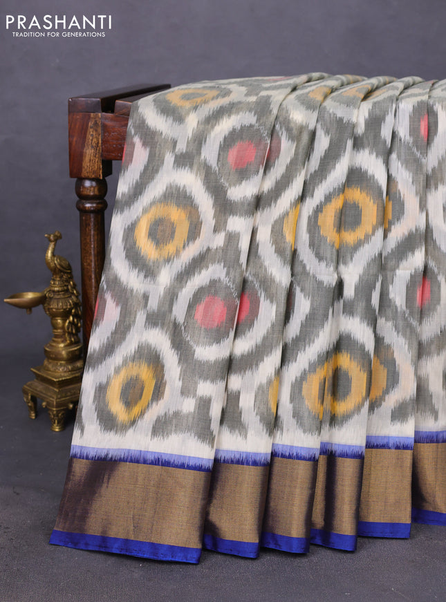 Ikat silk cotton saree grey and blue with allover ikat weaves and zari woven border