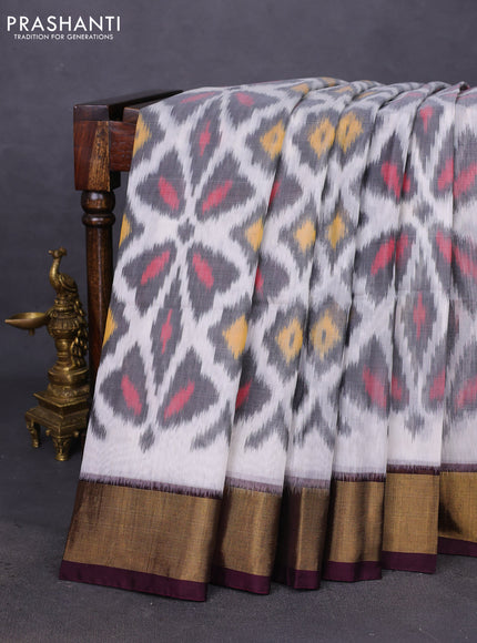 Ikat silk cotton saree off white and deep coffee brown with allover ikat weaves and zari woven border