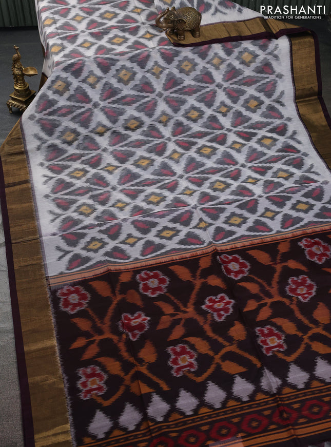 Ikat silk cotton saree off white and deep coffee brown with allover ikat weaves and zari woven border