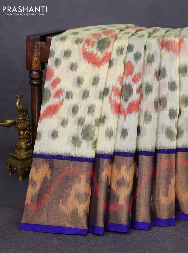 Ikat silk cotton saree mild pista green and blue with allover ikat weaves and ikat woven zari border