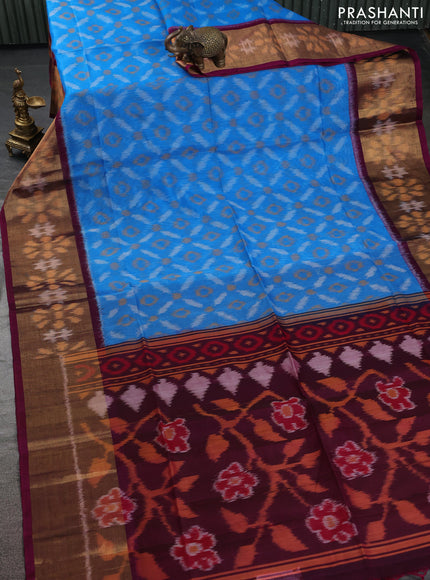 Ikat silk cotton saree light blue and dark magenta pink with allover ikat weaves and ikat woven zari border