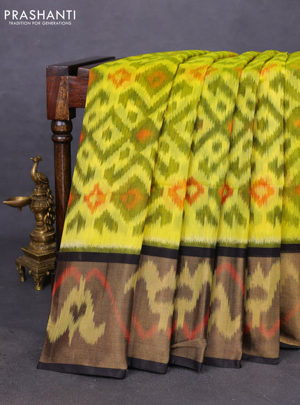 Ikat silk cotton saree lime yellow and black with allover ikat weaves and ikat woven zari border
